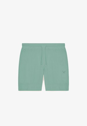 Shorts côtelés vert clair avec une ceinture élastique, un cordon de serrage, et un petit logo brodé d'ustensiles croisés sur la jambe droite.