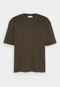 Brown cotton t-shirt with short sleeves, a crew neck, and a relaxed fit. Smooth texture with no visible patterns or accents.