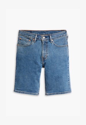 Heled sinine denim lühikesed püksid lõdva istuvusega, viie tasku, vöökohaga ja pronksitooni tarvikutega.