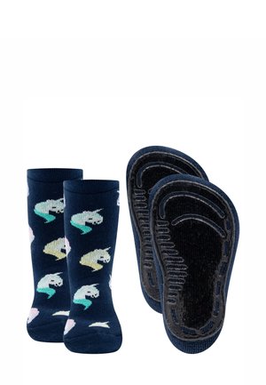 Children's navy blue socks with colorful unicorn patterns and black non-slip grips on the soles displayed side by side.