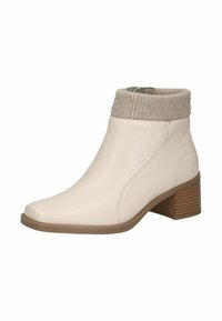 Stivale alla caviglia in pelle bianca con polsino beige a costine, punta a mandorla e tacco in legno impilato. Design elegante con dettagli di cucitura minimi.