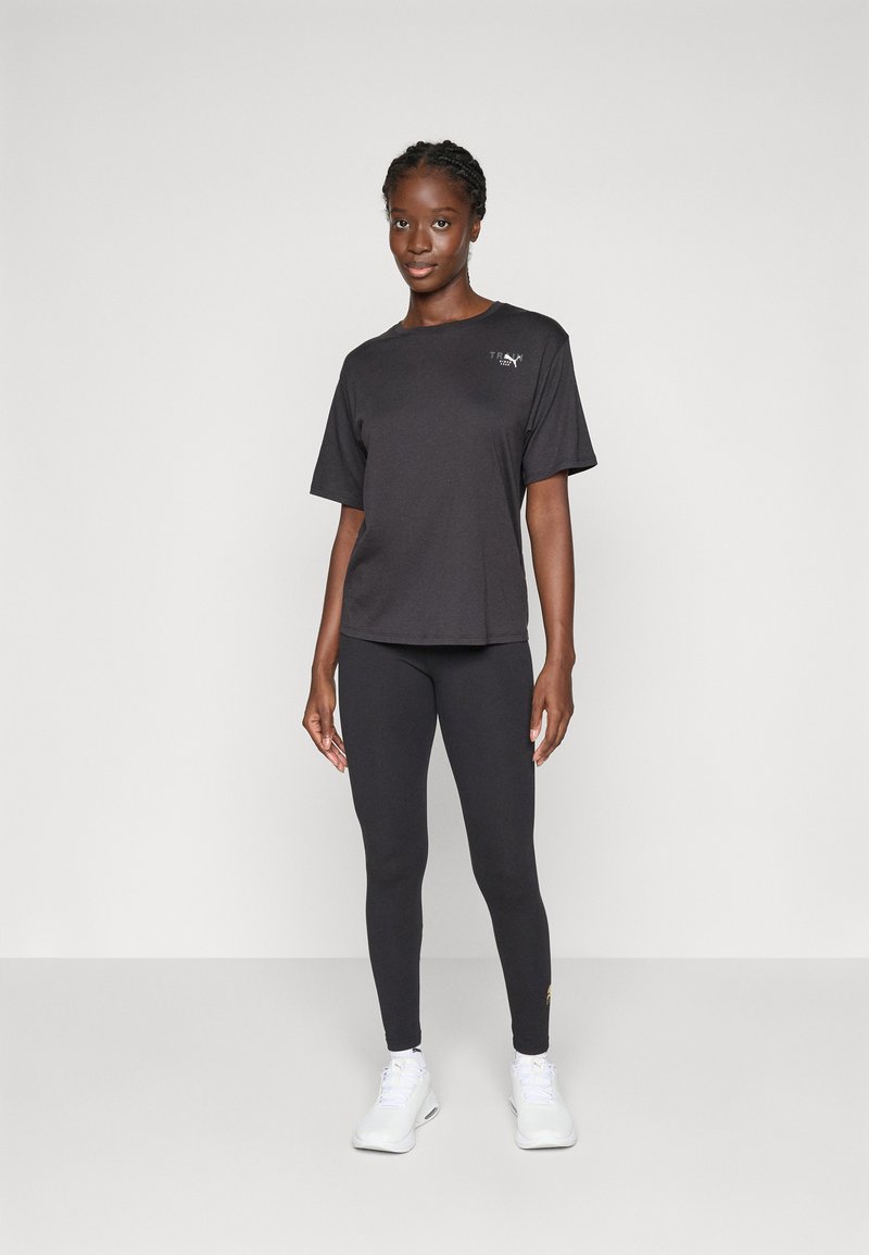 Puma PRETTY TOUGH GRAPHIC TEE - Sportovní tričko - black