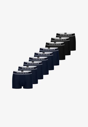 Ni par boxershorts i marineblåt og sort med hvide elastiske linninger mærket "Schiesser" vist i en diagonal række.