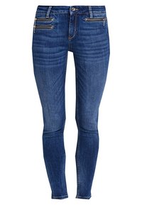 Jeans ajustados en denim azul oscuro, con dos bolsillos con cremallera en la parte delantera, corte slim y un ligero desgaste para añadir textura.