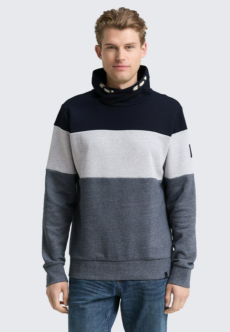 Pullover-Sweatshirt mit hohem Kragen, featuring marineblau, grau und hellgrau Farbblöcke, weichem Textil und gerippten Bündchen.