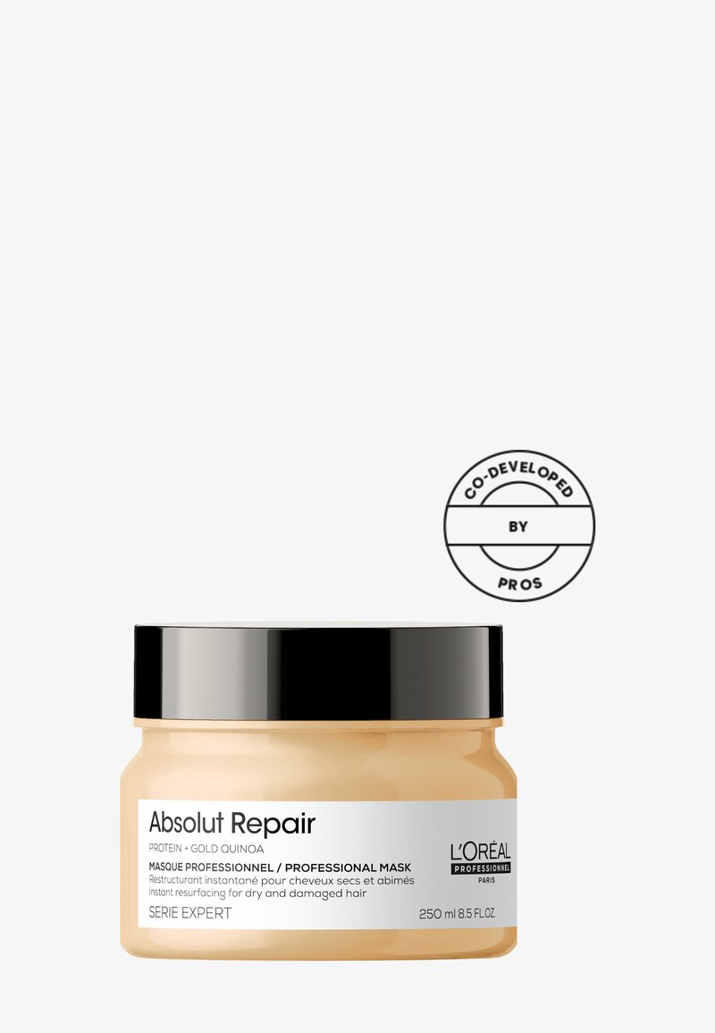 L'Oréal Professional Absolut Repair hårmask i en genomskinlig burk med svart lock. Krämig konsistens, märkt för torrt och skadat hår, 250 ml.