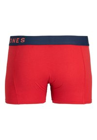 Rode katoenen boxershorts met een marineblauwe elastische tailleband waarop de tekst "JONES" in koraal staat. Strak aansluitend ontwerp met vlakke naden.
