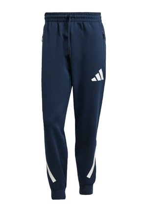 Pantaloni sportivi blu navy con vita elasticizzata, cordoncino, tasche laterali e strisce bianche a contrasto con logo sulla gamba sinistra.