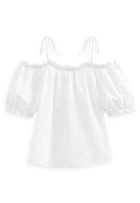 Blouse blanche à épaules dénudées avec manches bouffantes, ornée de broderies florales et d'un col élastiqué. Liens aux épaules pour l'ajustement.