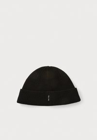 Black knitted beanie hat with a folded brim and vertical ribbed texture. Features a small black and white brand label on the side.