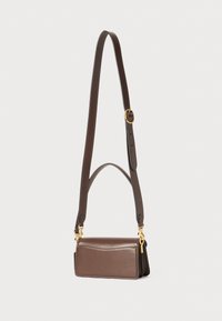 Brown leather bag with a rectangular shape, adjustable strap, gold-tone hardware, and a simple front pocket design.