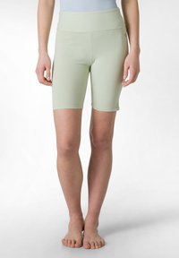 Ljusgröna stretchnära cykelshorts i bomullsblandning med bred elastisk midjeband, knälånga och med en slät, matt yta.