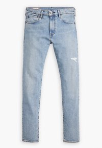 Ljusblå slitna jeans med rak passform. Har blekningar, lätt fransande vid knäna och metallknapp.