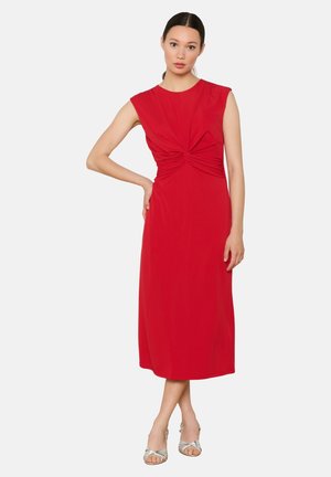 Red, knee-length dress with a fitted bodice, knotted detail at the waist, and cap sleeves. Smooth, lightweight fabric with a slight sheen.