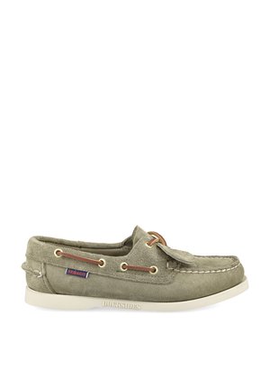 Light green suede boat shoe with white sole, leather laces through gold eyelets, and a small red and blue Sebago label on the side.