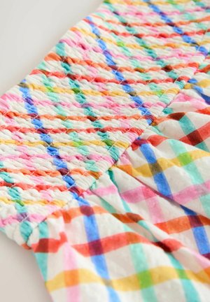 Multifarvet, smocket stof med et ternet mønster i pastelfarver som pink, blå, grøn og gul. Blød, struktureret overflade.