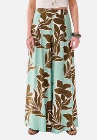 Brede broek van lichtgewicht stof, met een turquoise achtergrond en grote bruine en crèmekleurige bloemenpatronen.