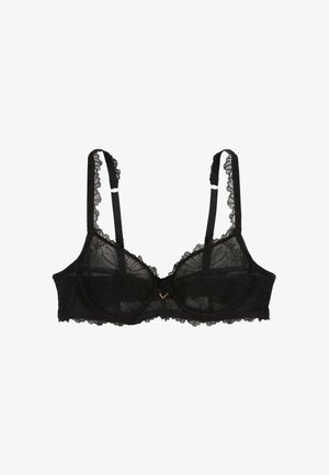 Soutien-gorge en dentelle noire avec des motifs floraux complexes, des bords en dentelle à festons, des bretelles réglables et un accent doré au centre. Matière semi-transparente.