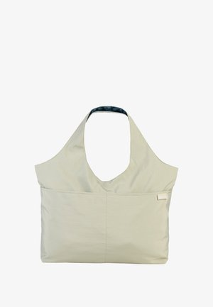 Lichtbeige stoffen draagtas met een groot, open ontwerp, een brede schouderband, een enkele voorkantzak en een blauwe binnenvoering.