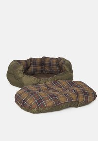 Round pet bed with green exterior and checked brown plaid interior. Comes with a flat cushion featuring similar plaid pattern. Soft, padded design.