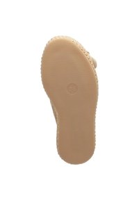 Beige rubber sole with textured surface, featuring a circular logo and size notation "36". Slightly curved shape at the heel.
