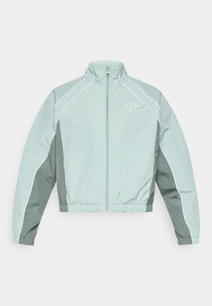 Light green zip-up windbreaker jacket with white piping, elastic waistband, and a small logo on the chest. Smooth, shiny texture.