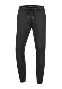 Black jogger pants with an elastic waistband and drawstring. Featuring a slim fit, smooth cotton blend fabric, and subtle side stitching.