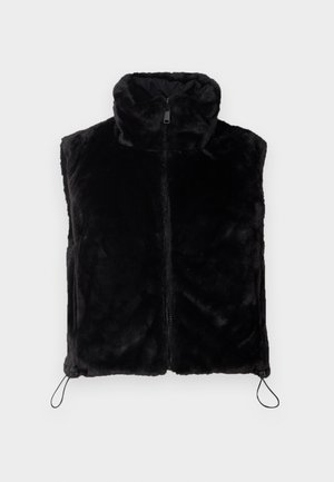 Gilet en fausse fourrure noire avec un col haut et une fermeture éclair à l'avant. Présente des détails à cordon au niveau de l'ourlet pour un ajustement personnalisé. Texture douce.