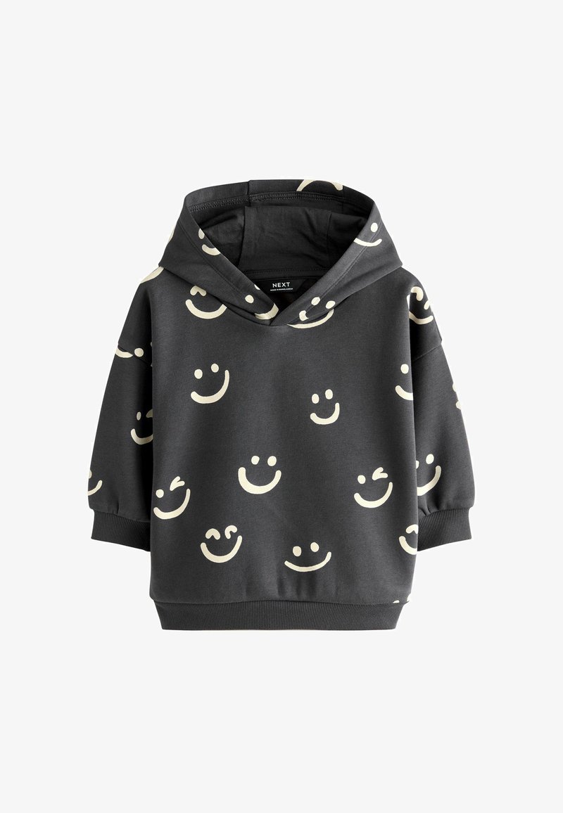 Hoodie in donkergrijze stof met een patroon van crèmekleurige glimlachende gezichten. Rib gebreide manchetten en zoom met een ontspannen pasvorm.