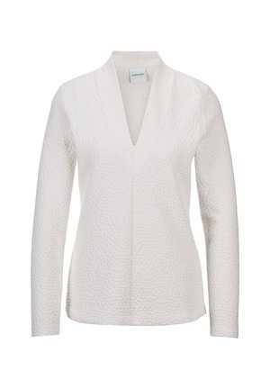 Weiße Langarmbluse mit strukturiertem Oberflächen, V-Ausschnitt und lockerer Passform. Verfügt über gestickte Details entlang der Kanten.