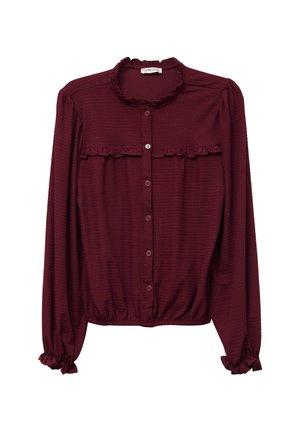 Blusa burdeos de manga larga con cuello y puños con volantes, cierre de botones en la parte delantera y tela texturada. Presenta un dobladillo fruncido y un detalle de volantes en la parte delantera.