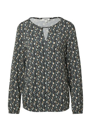 Blouse à manches longues en noir, crème et beige avec un motif géométrique ; présente un col rond et un détail en forme de trou de serrure à l'avant.
