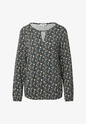 Langärmlige Bluse in Schwarz, Creme und Beige mit einem geometrischen Muster; besitzt einen runden Ausschnitt und ein Schlüsselaugen-Detail an der Vorderseite.