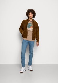 Nudie Jeans ROY - T-shirt estampada - brown melange