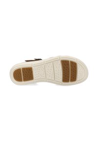 Brown leather sandal with a rubber sole featuring a textured white base and brown accents. Designed with multiple gripping patterns for traction.