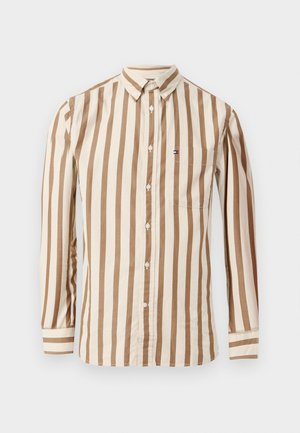 Langarmig shirt in beige met bruine verticale strepen. Beschikt over een button-down kraag, borstzak en witte knopen. Gemaakt van katoen.