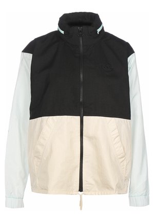 Veste zippée noire et beige avec manches bleu clair et col montant, poches avant et logo Adidas sur la poitrine.