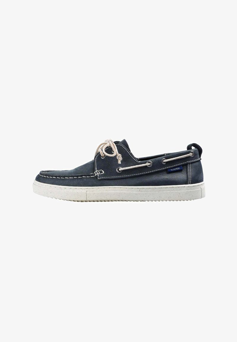 Navy blue leather boat shoe with white rubber sole, contrasting stitching, and beige laces. Features metal eyelets and a logo tag.