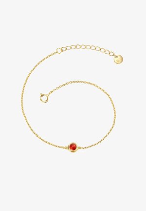Gold chain bracelet featuring a round red gemstone in a circular setting, delicate twisted texture, with an adjustable clasp and small charm.