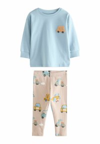 Light blue long-sleeve shirt with a textured vehicle applique. Beige leggings with a repeated pattern of cars, planes, and clouds in pastel colors.