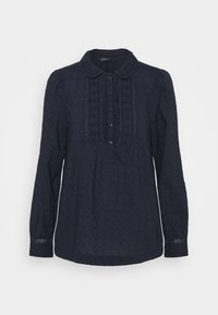 Blusa blu navy con maniche lunghe, colletto rotondo e motivo testurizzato intricato; presenta una chiusura centrale con bottoni e dettagli in pizzo sulle maniche.