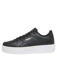 Must musta sneaker valge platvormiga tallaga, tekstureeritud ülemise osaga, ümarate varvastega ja delikaatse brändingu detailiga küljel.
