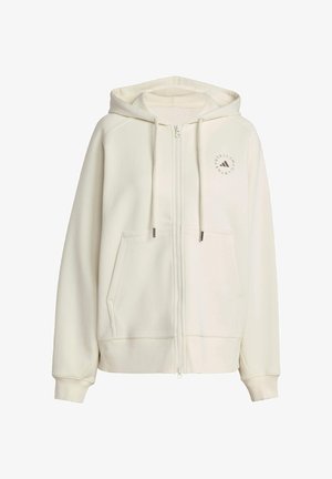 Felpa zip in colore crema realizzata in materiale morbido. Presenta una tasca frontale, cappuccio con cordini e logo circolare sulla parte sinistra del petto.