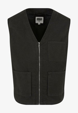 Must rõngas ilma varrukateta vest, mis on valmistatud orgaanilisest puuvillast, V-kaelusega, ees lukuga ja kahe küljetaskuga. Minimalistlik disain.