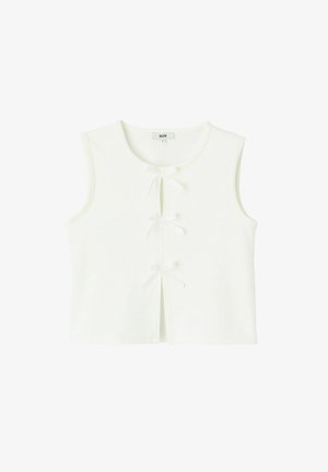 Haut court blanc sans manches avec trois petits nœuds en tissu sur le devant et un col rond.