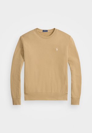Sweatshirt de culoare cămilă, realizat din bumbac. Are un decolteu rotund, manșete și tiv din material rib, cu un mic logo pe piept.