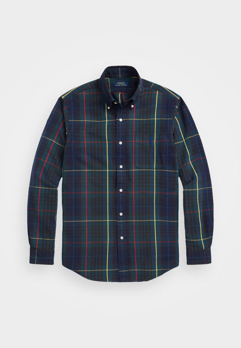 Camisa de cuadros de manga larga con patrones de cuadros en azul oscuro, verde, rojo y amarillo, cuello abotonado y bolsillo en el pecho. Material de algodón.