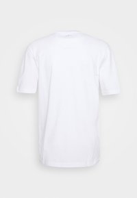 T-shirt bianca a maniche corte realizzata in cotone, con scollatura a girocollo e orlo dritto. Nessun logo o motivo visibile.