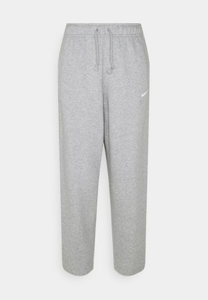 Světle šedé tepláky z měkké látky, s elastickým páskem se stahovacím šňůrkem a malým bílým logem Nike na levé straně.