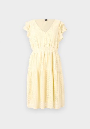 Short-sleeved yellow dress with a v-neck, textured floral patterns, smocked waist, and tiered skirt. Lightweight fabric with a flowing drape.